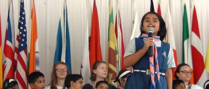 India - girl speaking with flags